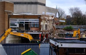 Demolition works begin near Bootle New Strand shopping centre as diggers can be seen taking down parts of a building