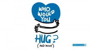 Blue heart with arms wrapped around it with the text: who would you hug and why?
