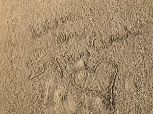 The words love the Sefton coast drawn in the sand at Ainsdale beach