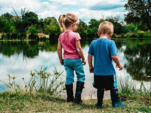 two children by a pond