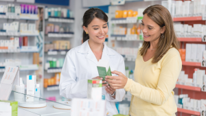A pharmacist speaking to a customer