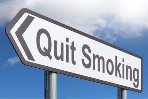 Road sign saying 'Quit Smoking'